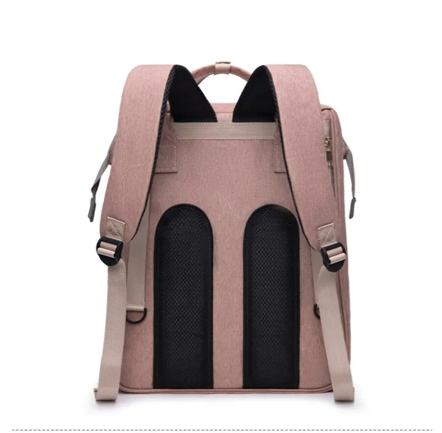 Un sac à dos Sac à Langer 3 en 1 Pour Maman & Bébé avec fenêtre de visualisation, conçu en tissu rose et équipé de panneaux en mesh noir pour une ventilation légère par BABY-PREMA.