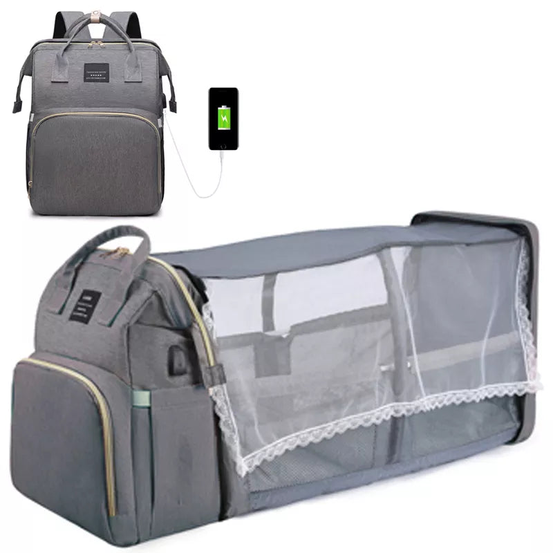 Un sac à dos multifonctionnel et léger Sac à Langer Bébé Bleu 3 en 1 avec un port de chargement USB intégré présenté en deux états : un avec le sac à dos entièrement intact et un autre affichant une fonction de berceau pliable pour mon bébé. Nom de marque: BÉBÉ PREMA