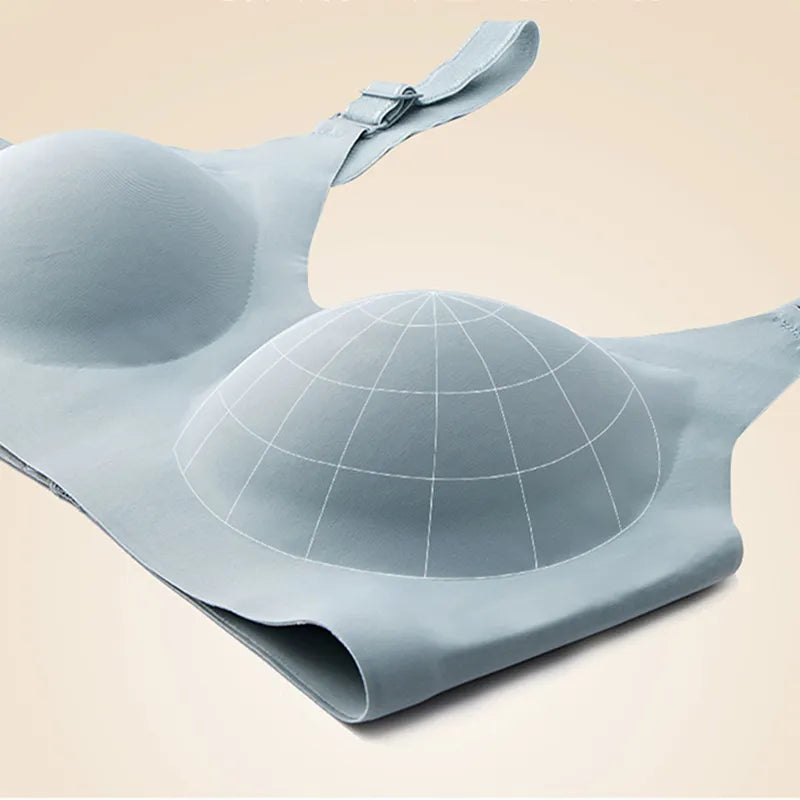 Un Soutien d'allaitement réglable sans bretelles gris de BABY PREMA avec un design de bonnet sphérique moulé sur un fond aux tons neutres, parfait pour la "Maternité".