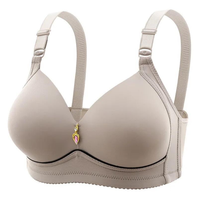 Un soutien-gorge push-up beige sans couture avec des bretelles réglables et un pendentif décoratif avec un panache de BABY PREMA.