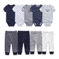 Six combinaisons pour bébé et cinq pantalons aux motifs et couleurs variés sont présentés sur deux rangées. Ce charmant Pack Pantalons & Bodies Bébé BABY PREMA comprend des bodys en coton aux couleurs unies, à rayures et à motifs imprimés, tandis que les pantalons présentent à la fois des unis et des rayures.