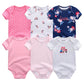 Six combinaisons pour bébé, ou Lot de 6 Pièces Body Coton Bébé de BABY PREMA, disposées sur deux rangées, présentant divers motifs dont des pois, des hiboux, des motifs floraux et des couleurs unies en rose, blanc et bleu marine.