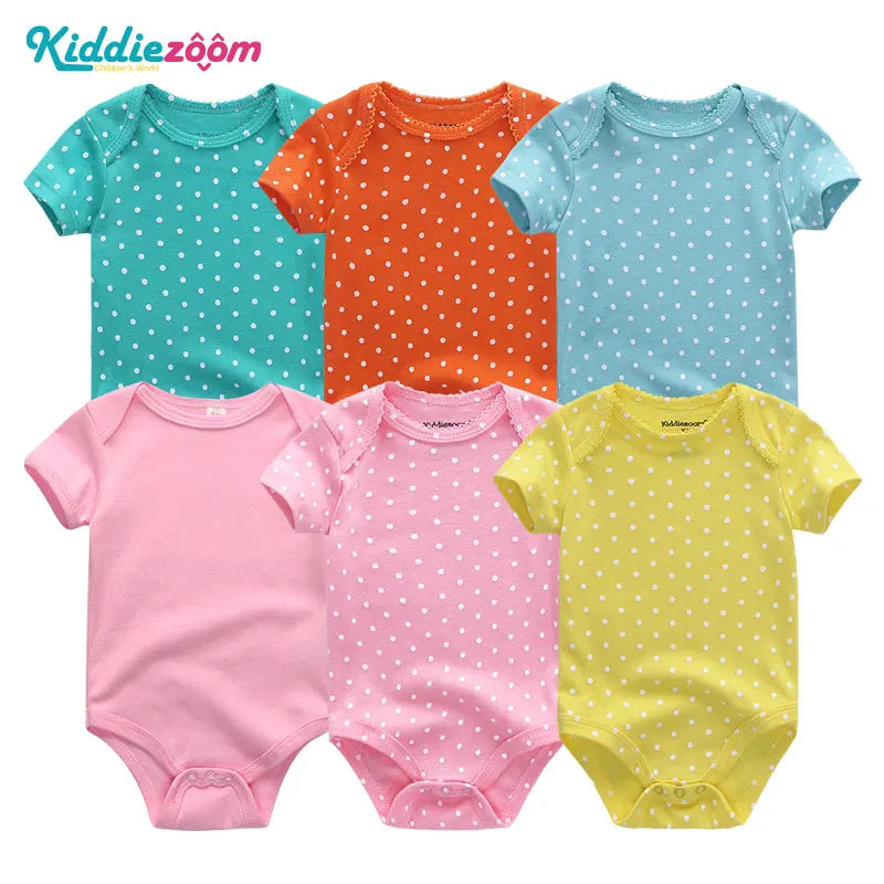 Six grenouillères colorées à pois pour bébé en bleu sarcelle, orange, bleu, rose, fuchsia et jaune sont présentées. Les Lot de 6 Pièces Body Coton Bébé à manches courtes sont disposés en deux rangées de trois. Le nom de la marque « BABY PREMA » est visible.