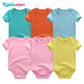 Six combinaisons à manches courtes pour bébé de différentes couleurs (vert, orange, bleu, rose et jaune) à pois blancs sont disposées sur deux rangées. La marque « BABY PREMA » est affichée en haut à gauche. Pour un style polyvalent, associez-le à notre collection Lot Body Bébé 6 Pièces en Coton aux designs confortables à col rond.