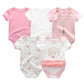 Five BABY PREMA Lot 5 Bodys Coton | Imprimés Manches Courtes à manches courtes : deux roses unies, une blanche unie, une blanche à motif floral et une blanche à motif floral, texte doré et une jupe à volants en tulle rose. Ces bodys en coton comportent également des boutons-pression pratiques pour un changement facile.