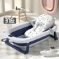 Un siège de bain bébé avec motif étoile reposant dans une baignoire en silicone pour Bébé BABY PREMA, équipé d'un affichage de température indiquant