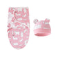 Un emmaillotage BABY PREMA rose douillet et un bonnet assorti avec un motif animalier blanc, parfaits pour garder un tout-petit bien au chaud.