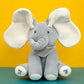 Un éléphant en peluche douce avec de grandes oreilles et une écharpe à pois sur fond jaune et vert, parfait pour un bébé.
Jouet éléphant en peluche | chantant avec Oreilles Mobiles par BABY-PREMA.