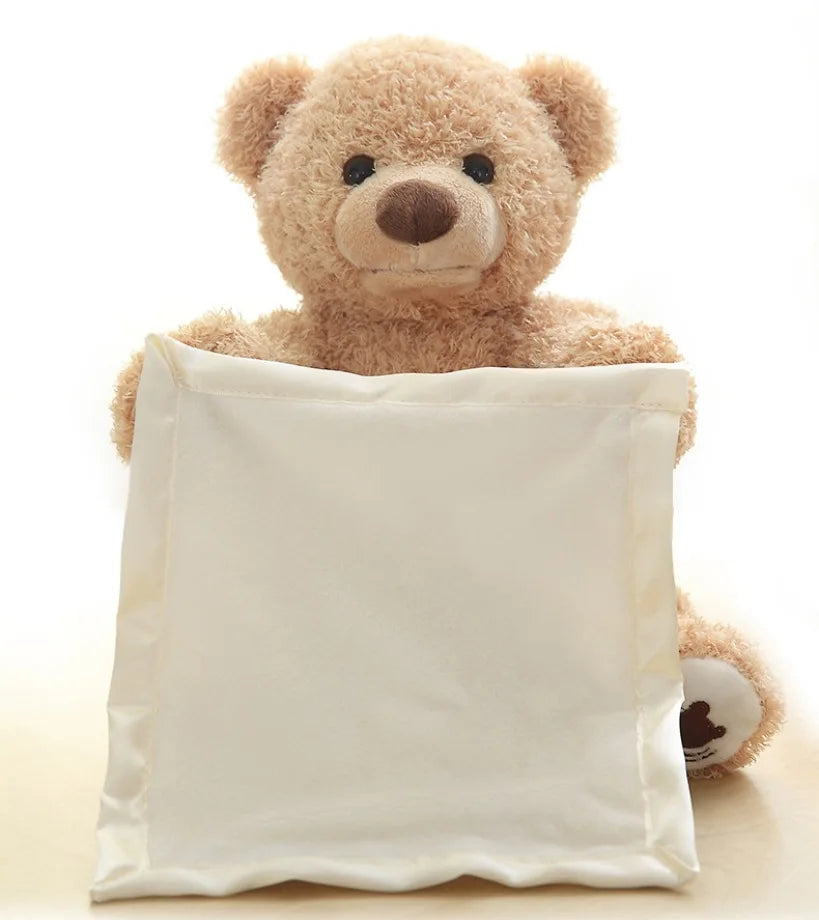 Une jolie peluche Doudou Ours qui sort d'un sac BABY-PREMA en tissu blanc.