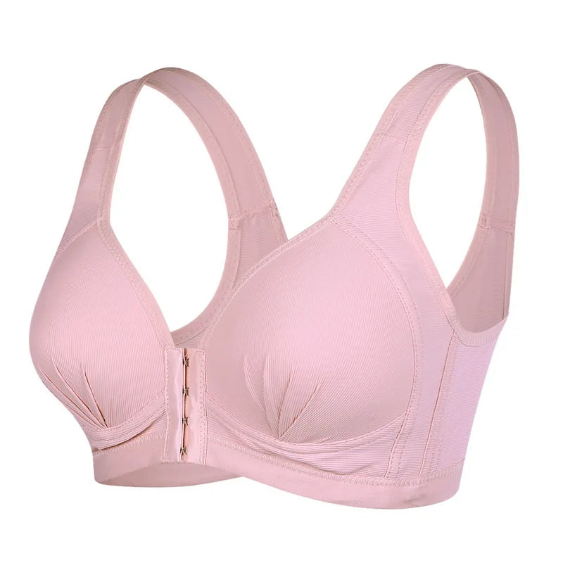 Un soutien-gorge de sport rose poudré avec une fermeture éclair sur le devant et un design poids léger sur fond blanc par Soutien Allaitement & Maternité Confortable de BABY PREMA.