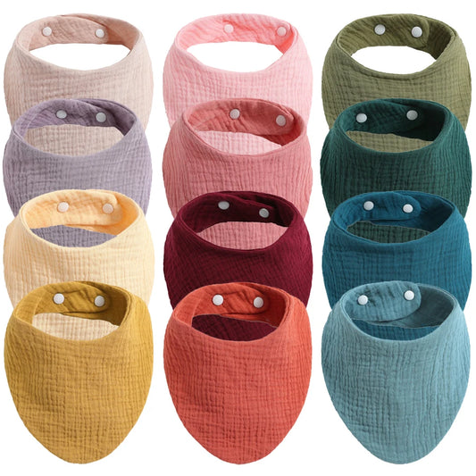 Une gamme colorée de Bavoirs 100% Coton pour Bébés BABY PREMA pour les repas, présentés dans de multiples nuances pour une protection élégante.