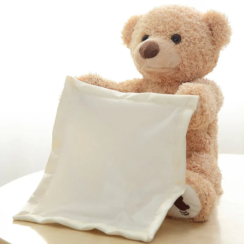 Un ours en peluche Doudou Ours Peluche Musical Chantant "Peekaboo" prêt à se blottir confortablement avec un oreiller blanc moelleux, parfait pour votre bébé prématuré de BABY PREMA.