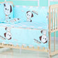 Lit bébé avec literie bleu clair avec de jolies illustrations de chiens, parfait pour un bébé prématuré - Ensemble 5 Pièces Literie Bébé en Coton de BABY PREMA.