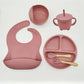 L'Ensemble 6-8 Pièces de Vaisselle pour enfants de BABY PREMA en silicone de haute qualité comprend un bavoir, une assiette sectionnée, des bols à ventouse, un bol, une tasse en paille, une cuillère et une fourchette, le tout placé sur un fond blanc.