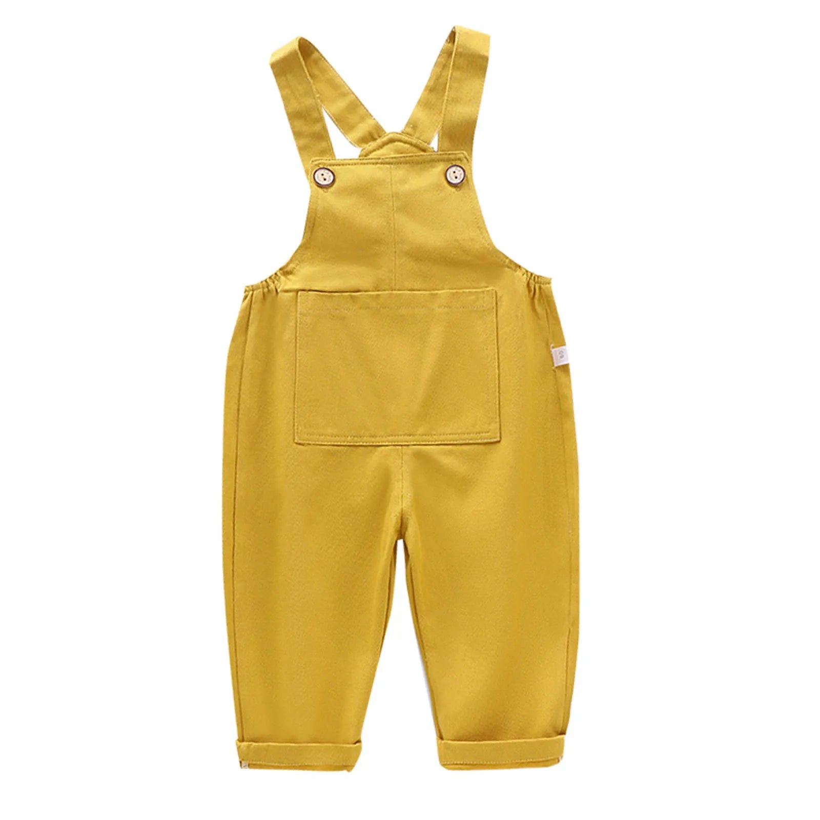 Une paire de Salopette Bébé Unie jaune de BABY-PREMA avec des bretelles, une poche avant et des détails de boutons sur les bretelles. Les jambes sont resserrées en bas, parfaites pour la garde-robe de votre tout-petit en version coton ou denim.