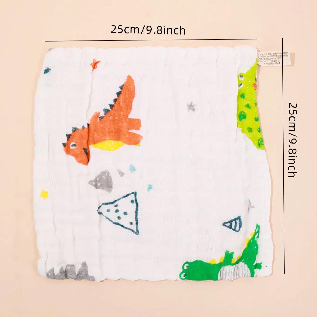 Un joli 5 Langes Coton Mousseline pour Bébé sur le thème des dinosaures BABY-PREMA avec une étiquette de mesure indiquant ses dimensions (25 cm / 9,8 pouces) sur un fond pêche doux, parfait pour l'hygiène de votre bébé