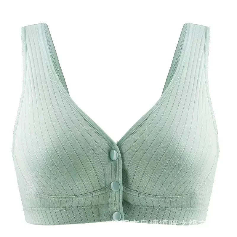 Une bralette en tissu côtelé vert pâle avec des détails de boutons sur le devant sur fond blanc, conçue avec un poids léger semblable à un panache par BABY PREMA.