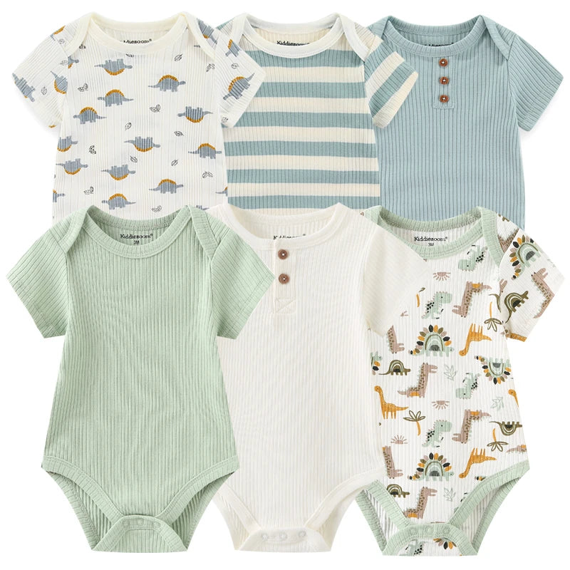 Six grenouillères pour bébé de différentes couleurs et motifs, notamment des dinosaures, des rayures et des couleurs unies, sont exposées. Ce Lot 6 Body Coton Bébé Manches Courtes de BABY PREMA est parfait pour assurer le confort de votre bébé tout au long de la journée.