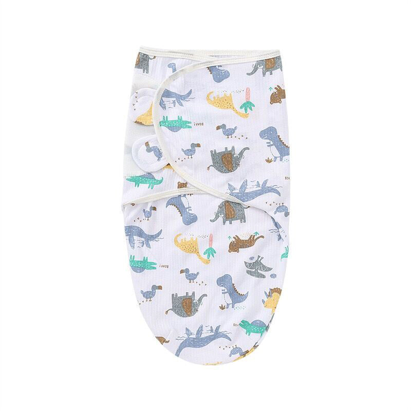 Emmaillotage pour bébé douillet de BABY PREMA avec d'adorables motifs imprimés de dinosaures pour une sensation de confort et de sécurité pendant le dodo.