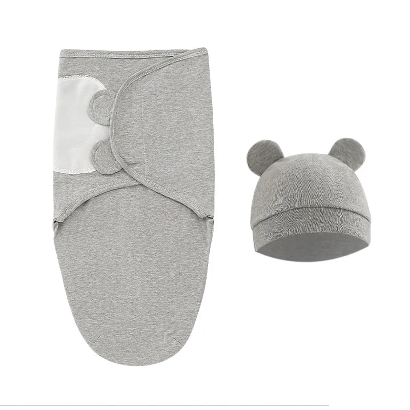 Gigoteuse Ajustable Coton pour Bébé grise avec attaches velcro et un bonnet assorti avec de jolis détails d'oreilles de BABY PREMA.