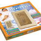 Un coffret "Sand Souvenir Avec ou Sans Cadre" de la marque LICOFUN. La boîte présente une image d'un bébé, le cadre en bois du kit avec une empreinte de bébé en sable naturel et un texte détaillant le contenu. Le fond est un ciel avec des nuages.