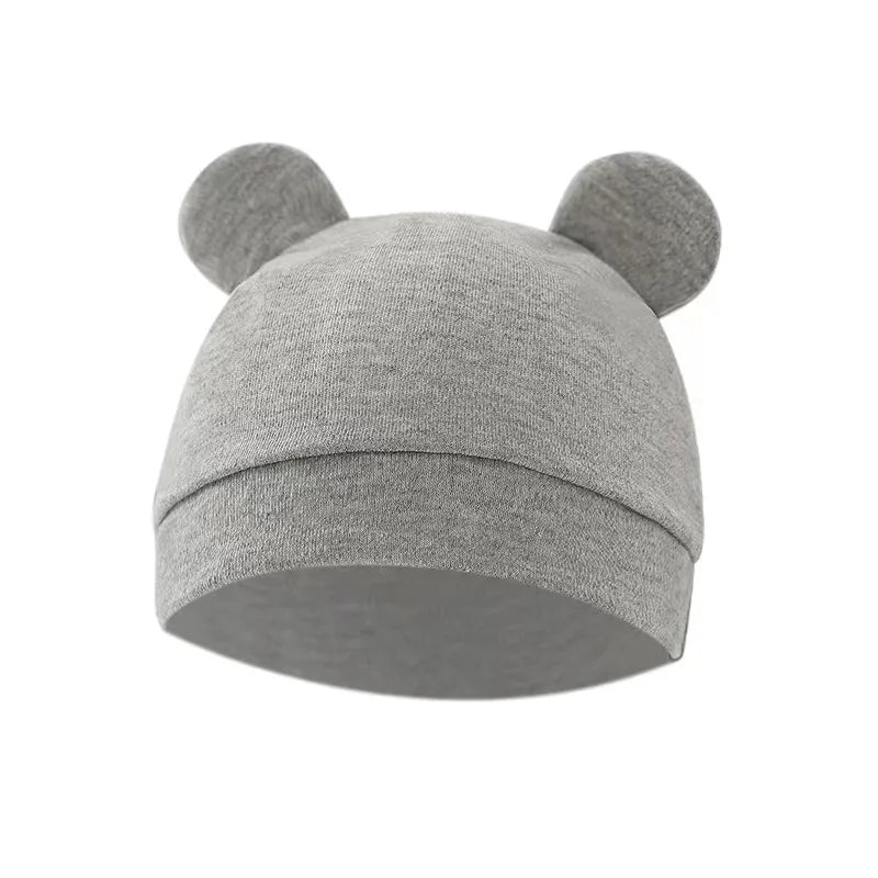 Une Gigoteuse Ajustable Coton pour Bébé de Baby Prema avec de jolis ornements d'oreilles sur fond blanc, parfaite pour garder un prématuré au chaud.