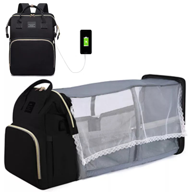 Un sac à langer noir polyvalent Sac à Langer Bébé Bleu 3 en 1 de BABY PREMA avec une fonction de chargement de téléphone et un berceau pliable intégré, parfait pour la maternité.