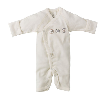 Combinaison bébé Dors Bien Pieds Préma - Early Birds couleur crème avec détails de têtes d'animaux et boutons pression sur fond blanc, un article indispensable bébé de BABY PREMA.